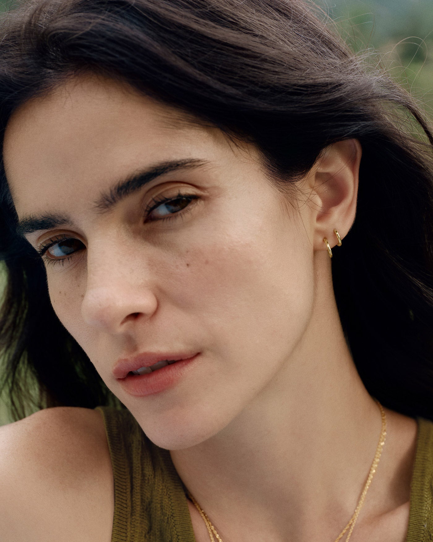 Gold Smooth Huggie Hoop Earrings Lifestyle Shot