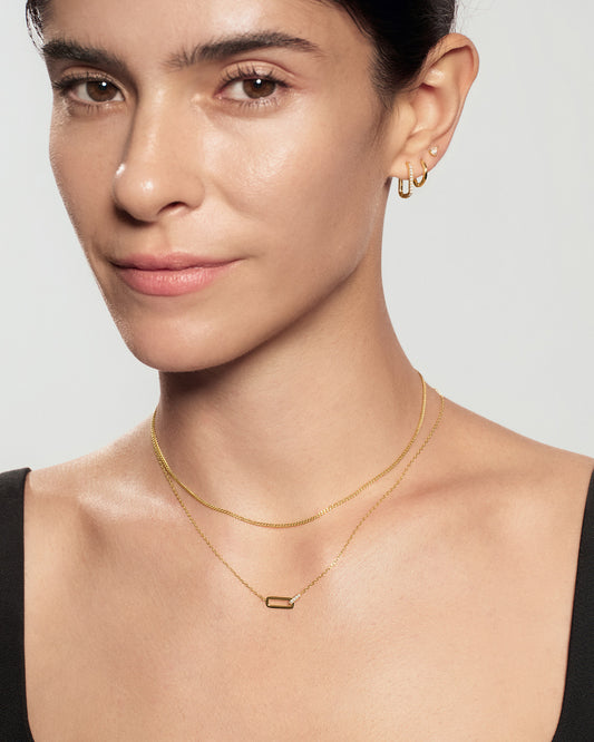 Minimalist gold interlock pendant necklace