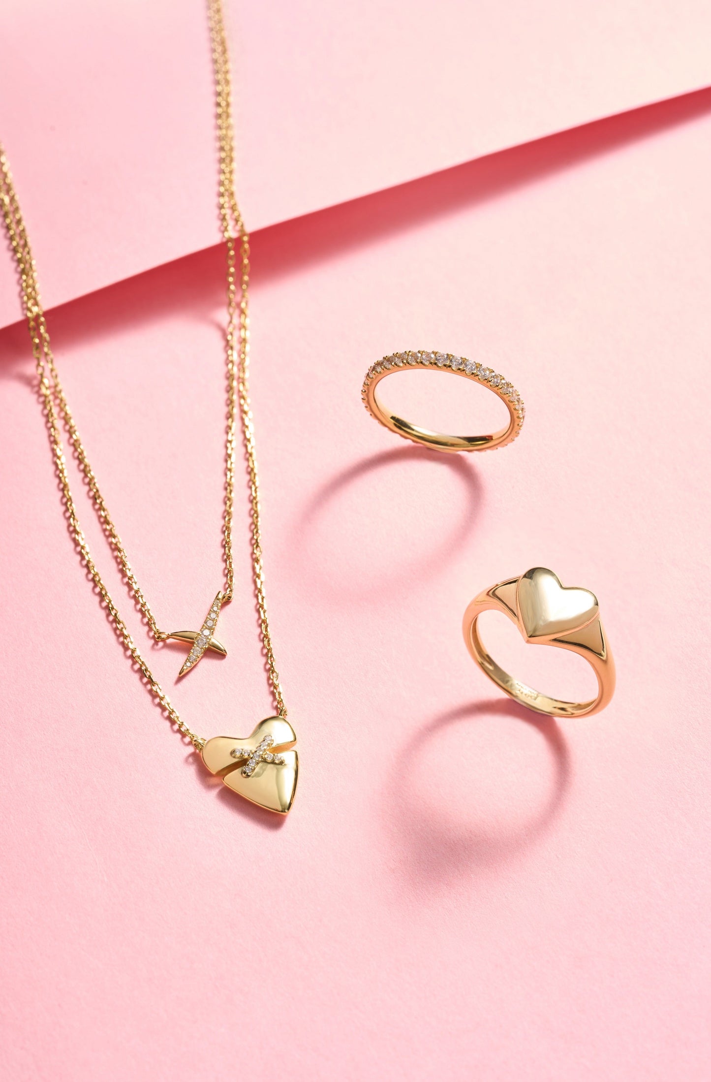 Matching gold pavé ring and heart pendant necklace collection