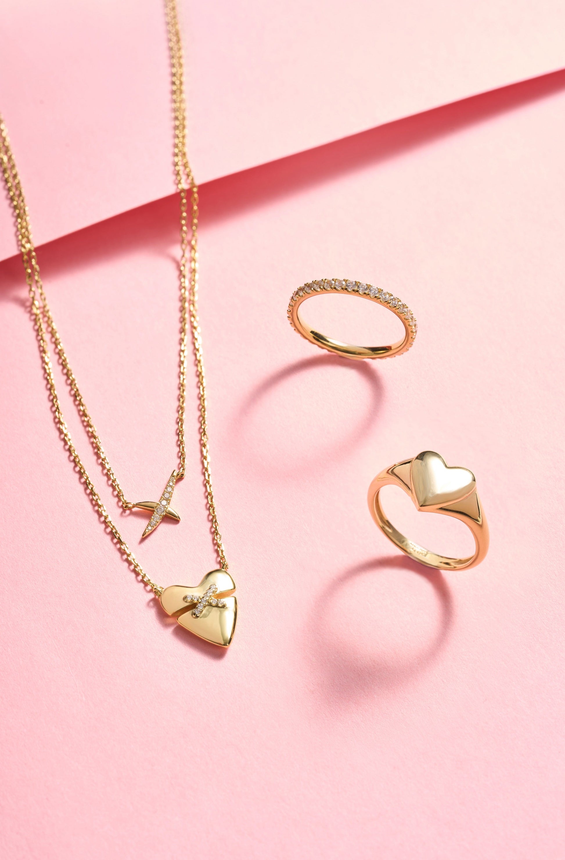 Matching gold pavé ring and heart pendant necklace collection