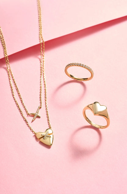 Matching gold pavé ring and heart pendant necklace collection