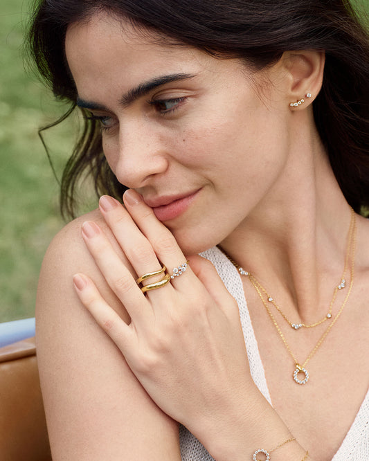 Gold Flower Cluster Pavé Ring on finger
