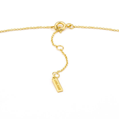 gold necklace featuring secure clasp closure detail